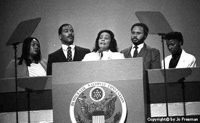 Coretta Scott King is flanked by her four children